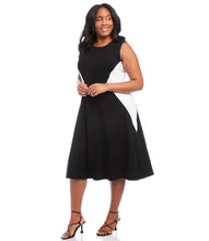 Load image into Gallery viewer, Colorblock panels flatter your figure while offering a cool modern touch to this soft jersey-knit midi dress. Its midi silhouette comfortably flows over the body in streamlined sophistication. Colors- Black and white. Colorblock. Sleeveless. Center back invisible zipper. Fabric -90% Rayon. 10% Spandex.
