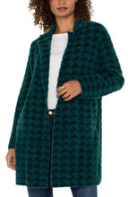 Load image into Gallery viewer, Introducing the Coatigan – a sophisticated blend of a coat and a cardigan. This mid-length coat is ideal for layering, accommodating both balmy nights and evening chills. Whether you are heading to the office, running errands, or enjoying a weekend brunch, this sweater coat serves as your perfect companion. It pairs well with denim, trousers, or leggings.
