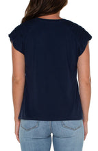 Load image into Gallery viewer, Make a statement in this essential raglan top. Featuring a sophisticated smocked shoulder detail that will certainly elevate your look. Add a touch of style to your wardrobe with this anything-but-basic knit top.  Color- Dark navy. Smocked shoulder detail. Short sleeves. Raglan sleeves. Scoop Neck.
