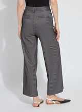 Load image into Gallery viewer, Person wearing black tee, black sheen line jean and black flats against a white background.
