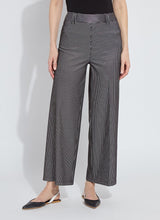 Load image into Gallery viewer, Person wearing black sheen line jean, black tee and black flats against a white background.
