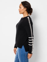 Load image into Gallery viewer, This pullover brings a unique touch to daily wear with its whipstitch detailing along the sleeves and contrasting white stripes on the cuffs. Crafted from a plush version of ultra-soft Zephyr yarn, this sweater provides comfort without sacrificing style. Designed with an easy fit, round neckline, and raglan sleeves, it accentuates a feminine silhouette. The high-low hemline rests at the hip, providing additional coverage at the back.
