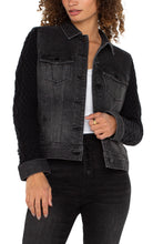 Load image into Gallery viewer, This jacket offers a contemporary twist on a classic design, blending the durable charm of denim with the snug comfort of knitwear. It boasts a button-front closure, a pointed collar, and chest pockets, all within a timeless silhouette. The contrasting knit sleeves provide a distinctive flair. Made from a soft, textured knit, the sleeves ensure both comfort and fashion, setting this jacket apart.
