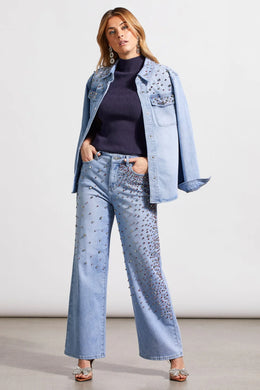 This striking sparkle and shine denim shirt perfectly brings together casual style with glamorous flair, adorned with striking rhinestone details in clear, pink, and red. It boasts a snap-up front, long sleeves with open cuffs, a crisp collar, and practical chest pockets, making it as functional as it is fashionable. 