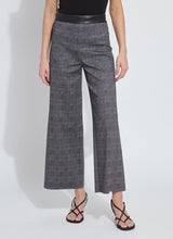 Load image into Gallery viewer, Person wearing gray plaid wide leg pants, black top and black sandals against a white background.
