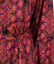 Load image into Gallery viewer, If you&#39;re in search of a dress with a distinctive, colorful print, our Sensation print dress is the perfect choice! It features a bow belt and buttons up to the waist. Crafted with an exterior of 100% polyester and a lining of 100% viscose, it not only maintains its beauty over time but also offers comfort.
