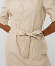 Load image into Gallery viewer, Close-up of belted light sand faux leather dress against a white background.
