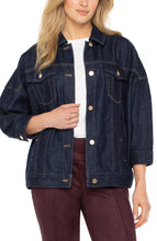 Load image into Gallery viewer, Model wearing a dark blue denim jacket over a white shirt and maroon pants on a white background.
