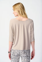 Load image into Gallery viewer, Discover the versatility of this reversible top, featuring a V-shaped neckline on one side and a round collar on the other. Perfect for any occasion, the contemporary design allows for effortless styling. With three-quarter dolman sleeves for added elegance and a relaxed fit, this top is both comfortable and chic.
