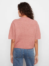 Load image into Gallery viewer, A woman viewed from the back wearing a short-sleeve ribbed knit top in a dusty rose pink color, paired with blue jeans, against a plain white background.
