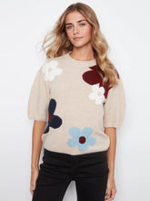 Load image into Gallery viewer, Woman wearing an elbow sleeve sweater with multicolor flowers and black pants against a white background.
