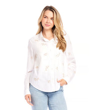 Load image into Gallery viewer, Enhance your closet with our expertly hand-embroidered embellished button up shirt. Delicately hand stitched flowers in a soft almond hue decorate this classic off white garment, adding a refined and sophisticated touch.
