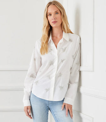 The Eden Embellished Button-Up Shirt by Karen Kane is a sophisticated and timeless piece designed to elevate your wardrobe. Featuring hand-embellished details, this shirt blends elegance with a relaxed fit for effortless styling. Crafted from laundered cotton poplin, it offers a breathable and lightweight feel, perfect for both casual and dressy occasions.