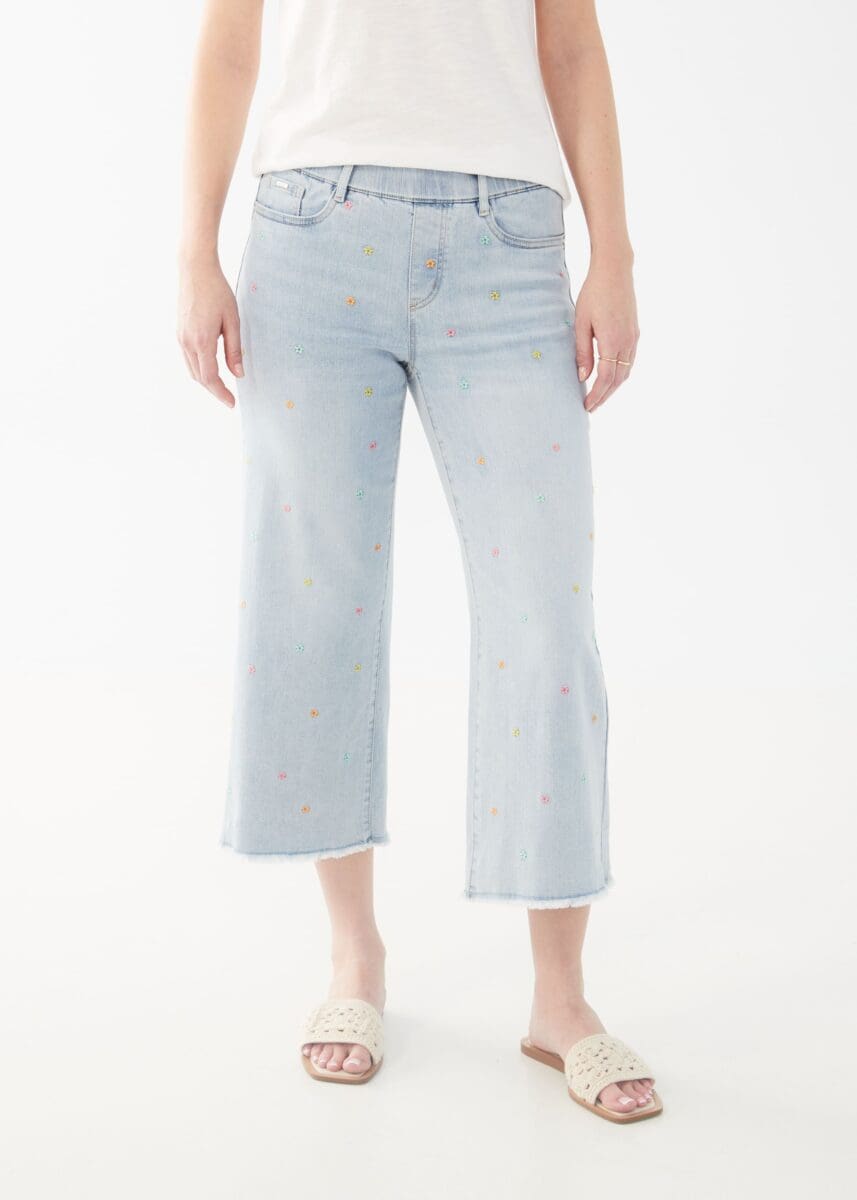 Experience the perfect combination of comfort and style with these French Dressing denim jeans. Designed for optimal ease and fashion, they boast a pull-on design and delicate pastel flowers on the front legs that beautifully complement the light wash blue.  Color - Sky blue. Embroidered pastel flowers. Non-functional pockets.