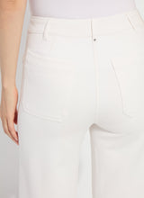 Load image into Gallery viewer, Close-up of the back of the chalk white pant against a plain background.
