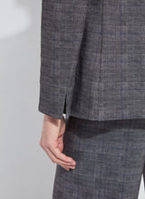 Load image into Gallery viewer, Closeup picture of the back of the left arm and slit at the wrist on the plaid blazer.
