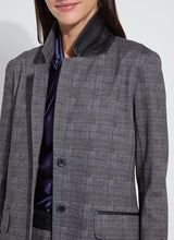 Load image into Gallery viewer, Grey checkered blazer worn by a woman posing against a white background.
