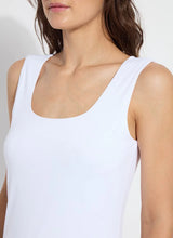 Load image into Gallery viewer, Constructed from COOL-FRESH™ ECO Jersey, the Evie Scoop Neck Tank features a wide, modern strap and a U-shape neckline, providing full coverage while keeping you cool and dry. Its double-self front and single layer back ensure opacity, and its sustainable design using recycled plastic bottle fibers makes it a conscious choice. Wear this versatile piece with jeans, shorts, or skirts for a stylish everyday look.

