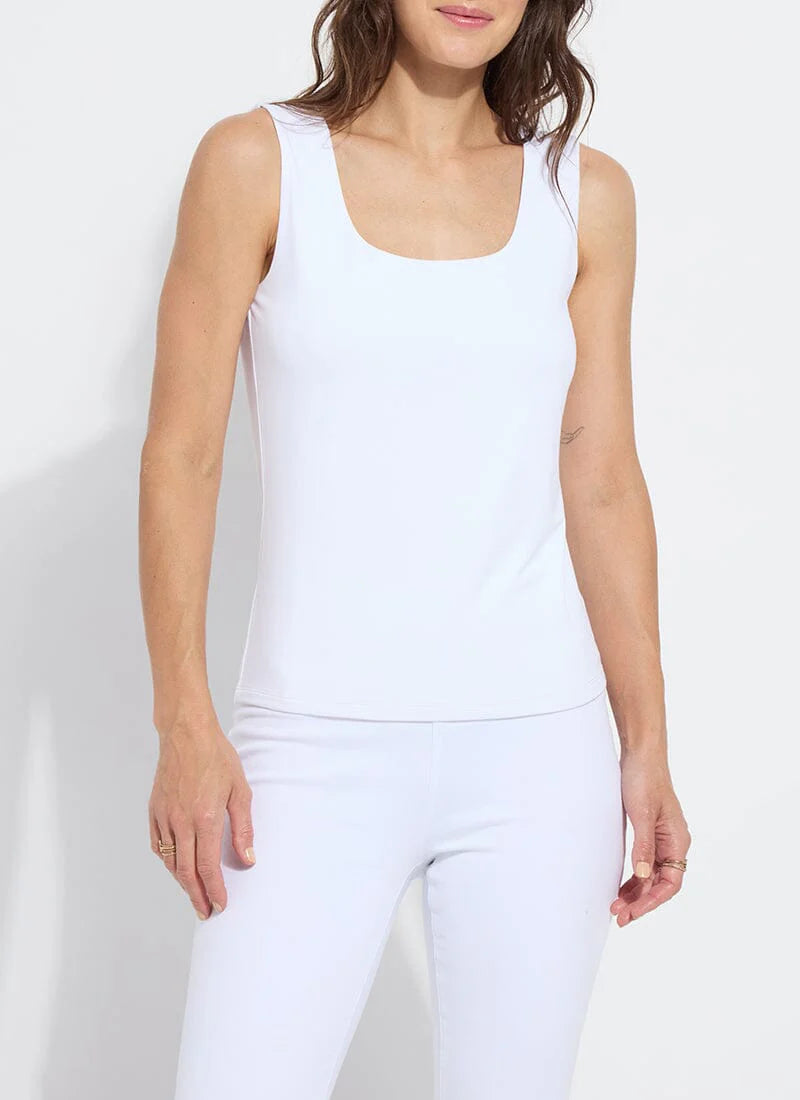 Constructed from COOL-FRESH™ ECO Jersey, the Evie Scoop Neck Tank features a wide, modern strap and a U-shape neckline, providing full coverage while keeping you cool and dry. Its double-self front and single layer back ensure opacity, and its sustainable design using recycled plastic bottle fibers makes it a conscious choice. Wear this versatile piece with jeans, shorts, or skirts for a stylish everyday look.
