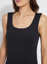 Load image into Gallery viewer, Constructed from COOL-FRESH™ ECO Jersey, the Evie Scoop Neck Tank features a wide, modern strap and a U-shape neckline, providing full coverage while keeping you cool and dry. Its double-self front and single layer back ensure opacity, and its sustainable design using recycled plastic bottle fibers makes it a conscious choice. Wear this versatile piece with jeans, shorts, or skirts for a stylish everyday look.
