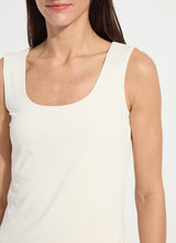 Load image into Gallery viewer, Woman wearing a macadamia-colored tank top against a white background.

