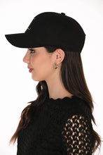 Load image into Gallery viewer, A woman wearing a black baseball cap with 'FL' embellished with silver embellishments on the front, paired with a black lace top, against a plain white background.
