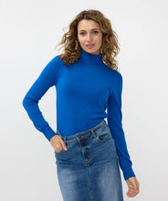 Load image into Gallery viewer, Crafted from durable and cozy fabric for optimal comfort, this turtleneck sweater showcases elegant shoulder details, featuring shiny gold buttons that add a touch of sophistication. The brilliant blue color complements any outfit, from casual jeans to dressy skirts.
