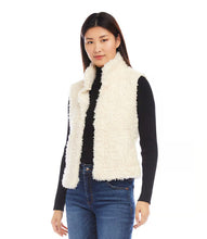 Load image into Gallery viewer, Indulge in luxury with our Faux Shearling Vest. Made from plush, faux shearling, this vest provides warmth and style all season long. Its versatile design enhances any outfit, from dresses to turtlenecks and jeans.
