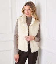 Load image into Gallery viewer, Indulge in luxury with our Faux Shearling Vest. Made from plush, faux shearling, this vest provides warmth and style all season long. Its versatile design enhances any outfit, from dresses to turtlenecks and jeans.
