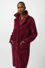 Load image into Gallery viewer, Woman wearing a burgundy coat against a white background.
