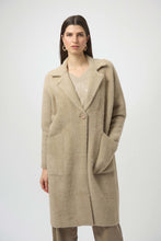 Load image into Gallery viewer, Woman wearing a long warm taupe coat, gold earrings and taupe jeans against a white background.
