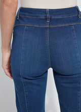 Load image into Gallery viewer, Close-up of fringe blue jeans with a white background.
