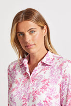 Load image into Gallery viewer, Add a dash of fresh floral fun to your wardrobe with this long-sleeve button-up featuring a border print on its lower half. High slits, an elegant bal collar, and stretch-infused fabric make this a winning choice. Wear long, closed or open or tied at the waist.
