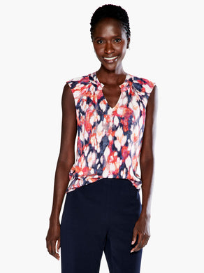 A pattern inspired by the garden in bloom, throw on this tank in our fan favorite Live In fabric and your look will blossom too. With a band collar and raglan sleeve details that add some sophisticated shape to the bright look, this top is the garden party you can wear. The hem falls slightly below the hip and we've added a touch of stretch to keep you extra comfortable.  Color-Blue Multi.