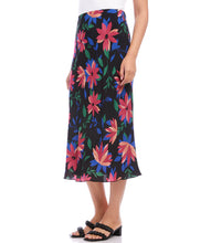 Load image into Gallery viewer, A vibrant floral print enhances the romantic charm of this swingy bias cut skirt in a stylish midi length. It features an easy pull-on silhouette that flows away from the body in streamlined sophistication. Colors- Black, blue, green, pinks. Lined. Bias cut. Elasticized waistband. Fabric- 100% Rayon. Care- Dry clean.
