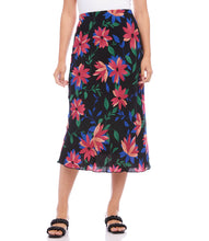 Load image into Gallery viewer, A vibrant floral print enhances the romantic charm of this swingy bias cut skirt in a stylish midi length. It features an easy pull-on silhouette that flows away from the body in streamlined sophistication. Colors- Black, blue, green, pinks. Lined. Bias cut. Elasticized waistband. Fabric- 100% Rayon. Care- Dry clean.
