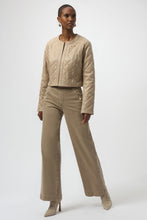 Load image into Gallery viewer, Woman wearing a warm taupe quilted jacket with silver embellishments, warm taupe jeans and taupe suede boots against a white background.
