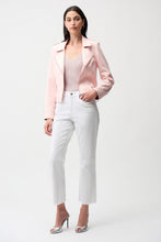 Load image into Gallery viewer, Woman wearing a light pink jacket over a sequin top, white pants and silver heels against a white background.
