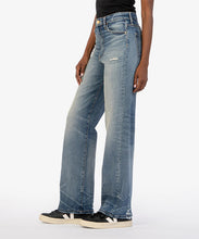 Load image into Gallery viewer, Achieve the ultimate balance between casual and refined with these high-waisted jeans. Designed with full-length wide legs, they feature creased detailing for a sophisticated trouser look. The medium base wash and slight distressing add just the right amount of edge.
