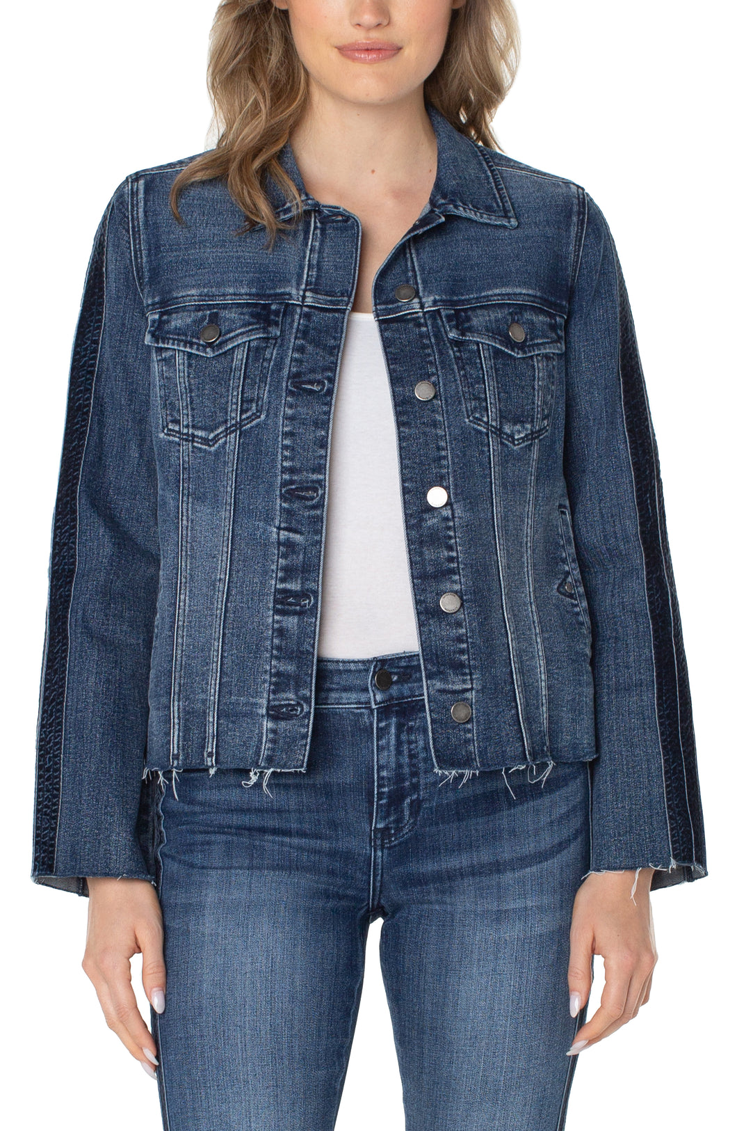 The timeless jean jacket gets a modern edge with a frayed hem and velvet trim adorning the silhouette. Its versatility makes it ideal for a range of occasions and it can easily be elevated when paired with the coordinating Hannah Crop Flare.  Color- Gilmore; dark blue with fading. Button front closure. Velvet trim down arms. Elevated frayed hem details. Flap patch pockets.