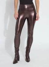 Load image into Gallery viewer, Constructed from Lightweight Vegan Leather in a metallic, Diffused Copper finish, the Freya Legging is garment washed to achieve 3D texture and softness. Boasting a patented concealed waistband and sans side seams, the Freya offers a snug, yet flexible fit. With 4-way stretch for comfort, it pairs perfectly with a white blouse, cropped vegan leather jacket, and black mules.
