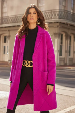 This exquisite long coat features a notched collar, long straight sleeves, and is crafted from a plush knit fabric. The unlined silhouette is perfect for layering on top of your desired look, and side pockets provide convenient storage for items you may need.  Color - Opulence Fuchsia. Plush fabrication. Front pockets. Gold button hardware. Long coat. Unlined.