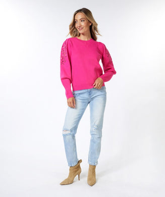 Discover sophistication with our Fenia Embroidered Sweater. Made of soft fabric with fine cut out embroidery on the upper sleeves, this sweater adds a stylish and feminine element to any outfit. An essential garment for a charming and trendy look!  Color- Fuchsia. Cut out embroidery on upper sleeves. Blouson sleeve design. Pull over. Crewneck.