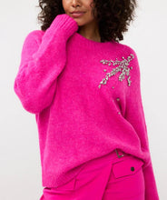 Load image into Gallery viewer, Expertly crafted, the Esqualo Cerise Pink Sweater perfectly combines comfort and sophistication. This oversized, cozy garment is embellished with elegant rhinestones, adding a touch of glamour to any outfit. It will make a statement while keeping you warm. Pair it effortlessly with jeans or skirts for a head-turning look.
