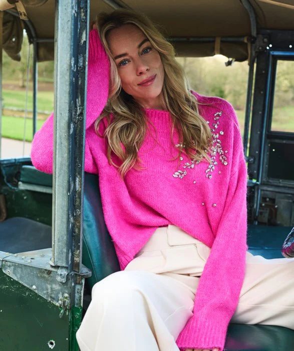 Expertly crafted, the Esqualo Cerise Pink Sweater perfectly combines comfort and sophistication. This oversized, cozy garment is embellished with elegant rhinestones, adding a touch of glamour to any outfit. It will make a statement while keeping you warm. Pair it effortlessly with jeans or skirts for a head-turning look.