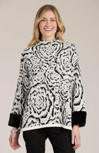 Load image into Gallery viewer, Stand out in style with this Frady Funnel Abstract Cape from Tyler and Boe. The black and white design exudes a modern but classic feel, while the faux fur trim adds a touch of luxury. You definitely will make a fashion statement when you walk into a room wearing this gorgeous top.
