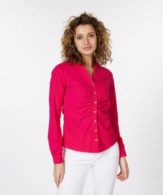 An amazing fuchsia color adorns this sleek, stretch fabric to create a sophisticated blouse that is sure to provide you compliments.  Shiny, gold buttons add a pop of elegance to this stunning top.  A gathered front adds extra glamour.   Pair with a pair of white or black pants for a more formal look or wear with your favorite denim on casual days.