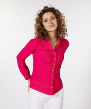Load image into Gallery viewer, An amazing fuchsia color adorns this sleek, stretch fabric to create a sophisticated blouse that is sure to provide you compliments.  Shiny, gold buttons add a pop of elegance to this stunning top.  A gathered front adds extra glamour.   Pair with a pair of white or black pants for a more formal look or wear with your favorite denim on casual days.
