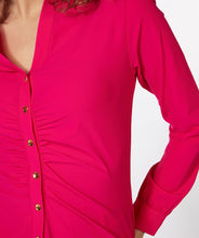 Load image into Gallery viewer, An amazing fuchsia color adorns this sleek, stretch fabric to create a sophisticated blouse that is sure to provide you compliments.  Shiny, gold buttons add a pop of elegance to this stunning top.  A gathered front adds extra glamour.   Pair with a pair of white or black pants for a more formal look or wear with your favorite denim on casual days.
