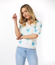 Load image into Gallery viewer, A lightweight V-neck sweater top is a perfect style for all year long. The details on our lovely Geneva creates a feminine and modern style that will match with shorts to skirts and everything in between.  Color of blue and aqua geometric patterns pop on a white background.  
